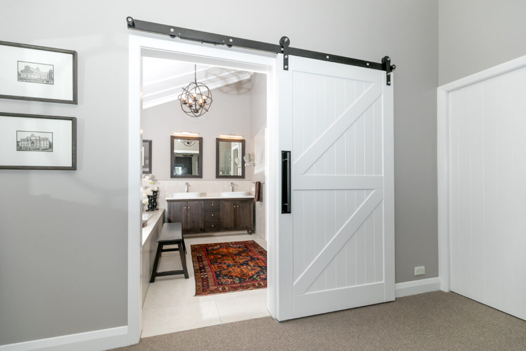 Luxury ensuite entrance with sliding barn door