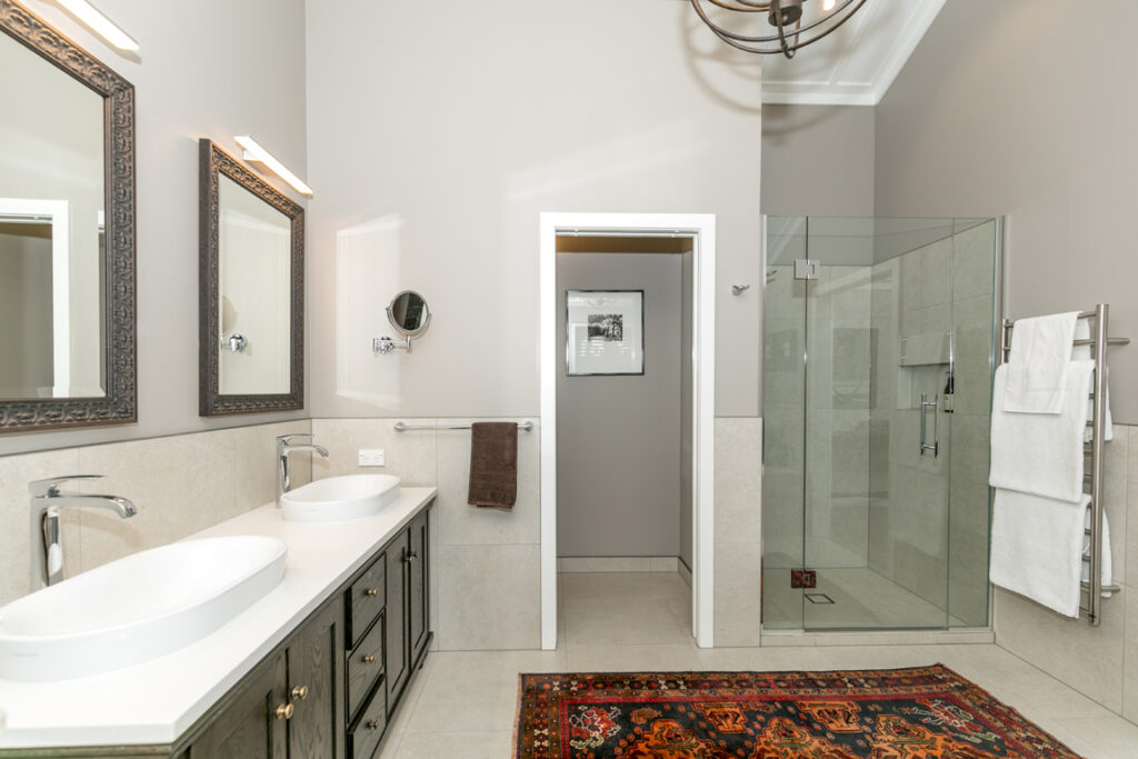 Luxury ensuite vanity and shower with rug