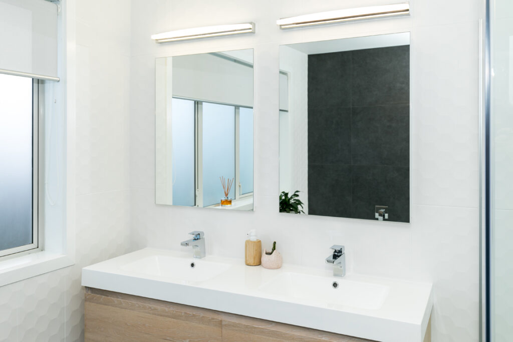 Modern bathroom double vanity with twin mirrors